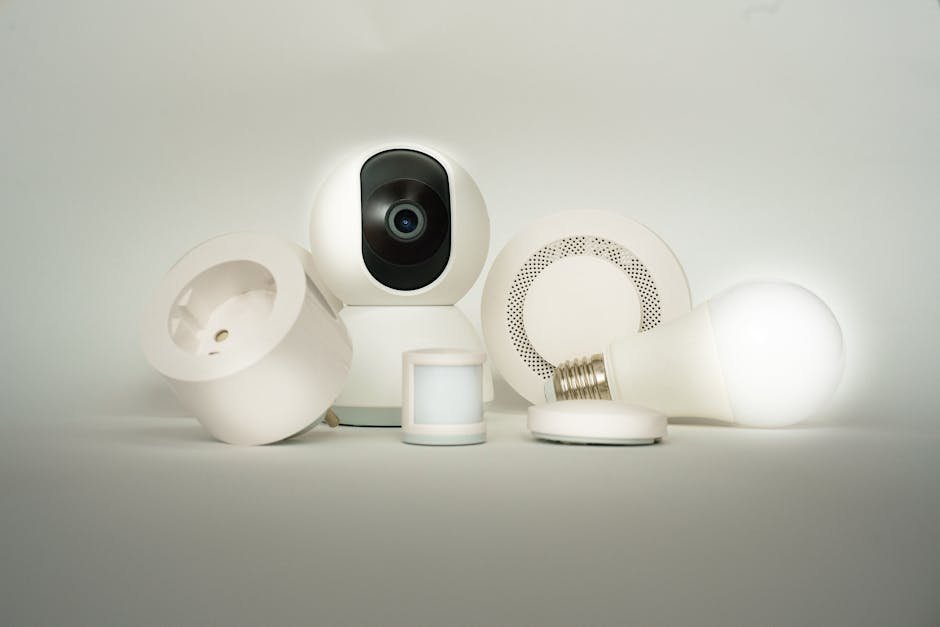 A collection of smart home devices, including a camera, light bulb, and sensors, on display.